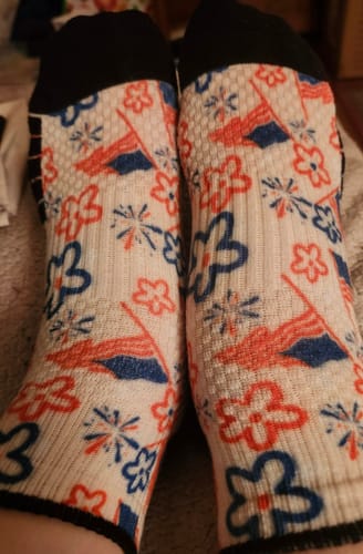 Customer's American Nostalgia Ankle Compression Socks featuring a festive red, white, and blue floral pattern on feet.