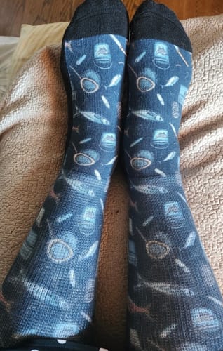 Customer's Viasox EasyStretch Socks featuring a blue fish and bucket pattern, worn on legs.
