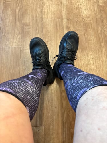 Customer's Ocean of Stars Compression Socks worn with black shoes, featuring a patterned blue and black design.